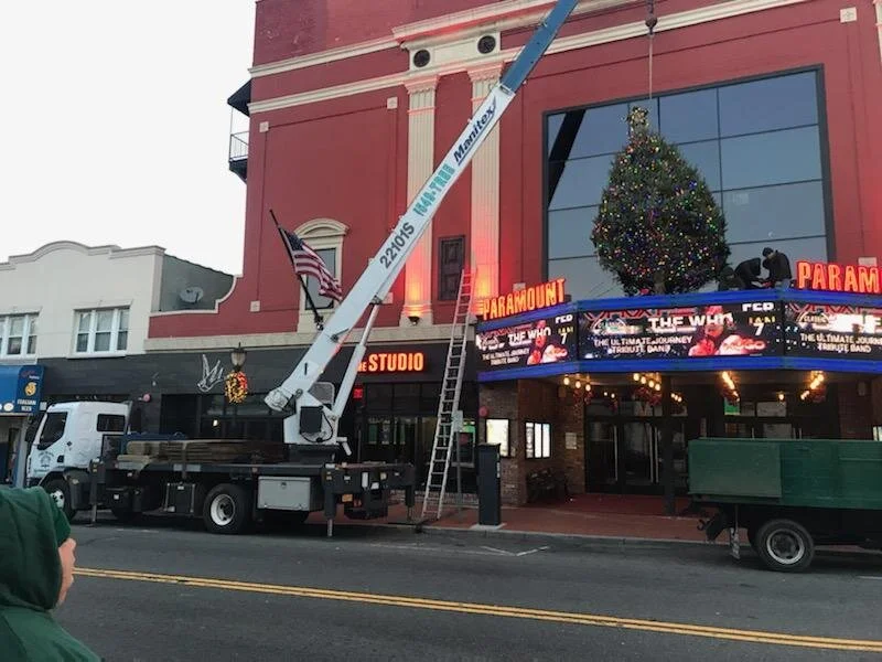 placing Christmas tree on top of the paramount theater
